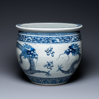 A Chinese blue and white 'dragons' fish bowl, Qianlong/Jiaqing