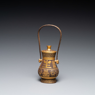 A Chinese gold-leaf-decorated cast iron vase and cover, probably 19th C.