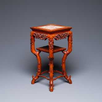 A Chinese carved wooden marble top stand, 19th C.