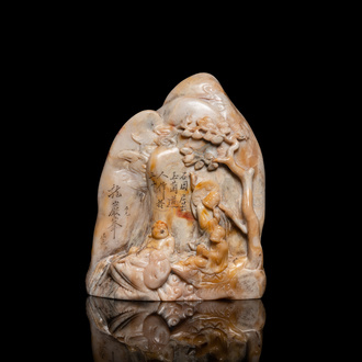 A Chinese Shoushan soapstone seal group depicting figures beneath a mountain, 19th C.