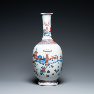 A Chinese blue, white and copper red 'antiquities' bottle vase, Qianlong