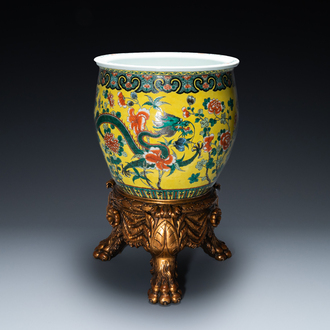 A Chinese yellow-ground famille verte 'dragons' fish bowl on gilded wooden stand, 19th C.