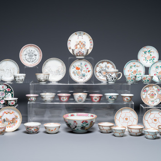 A varied collection of Chinese famille rose and grisaille cups and saucers and a 'rooster' bowl, Yongzheng/Qianlong