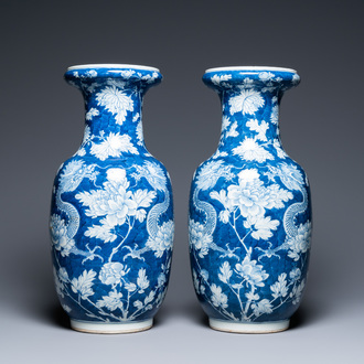 A pair of Chinese blue and white 'dragon and peony' vases, 19th C.