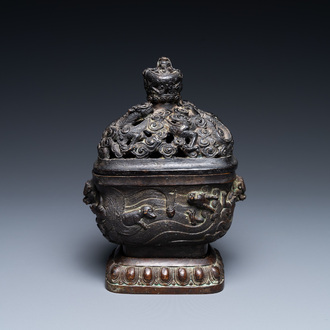 A Chinese bronze 'mythical beasts' censer and cover, 17th C.