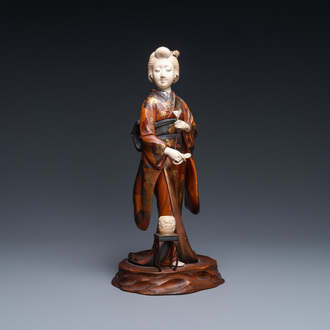 A Japanese lacquered wood, ivory and mother-of-pearl inlay 'Geisha' okimono, Meiji, 19th C.