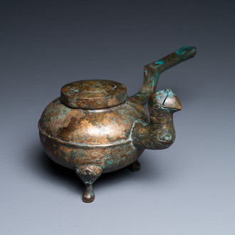 A Chinese gilt bronze tripod 'He' kettle with bird head-shaped spout, Han