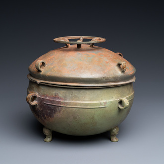A Chinese bronze ritual tripod 'zhan' food vessel and cover, middle to late Spring and Autumn period