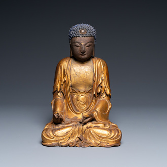 A Chinese gilded and lacquered wooden figure of Buddha, Ming