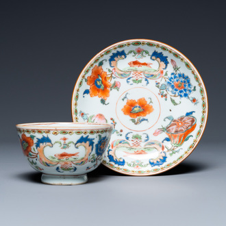 A Chinese famille rose 'Pompadour' cup and saucer, Yongzheng/Qianlong