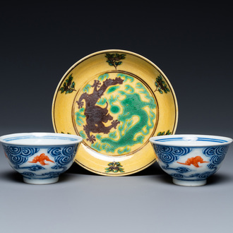 A pair of Chinese blue, white and iron-red cups and a yellow-ground 'dragon' dish, Guangxu mark and of the period