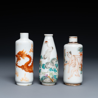 Three Chinese iron red and famille rose snuff bottles incl. one with an erotical subject, 19th C.