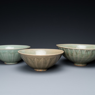 Three Chinese celadon-glazed 'lotus' bowls, Song