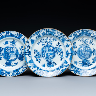 Three Chinese blue and white dishes with raised central medallions, Kangxi