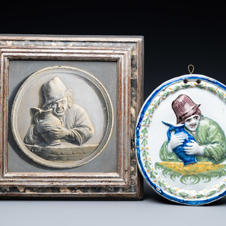 A polychrome Brussels faience oval molded plaque and a matching grisaille painting on copper of a man with a jug, early 19th C.