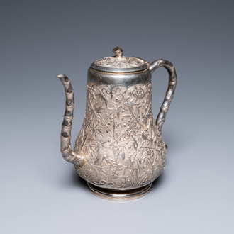 A Chinese silver teapot with birds among blossoming branches, 19th C.