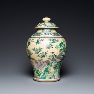 A Chinese yellow-ground verte biscuit vase and cover, 19th C.