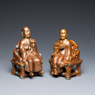 A pair of Chinese partly gilded seated figures, Zeng Long Sheng Zao mark, 20th C.