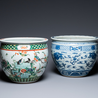 A Chinese blue and white 'dragons' fish bowl and a famille verte 'magpies' fish bowl, 19th C.