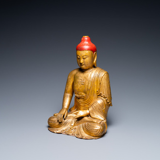 A Vietnamese or Japanese gilded and lacquered wooden Buddha, 19th C.