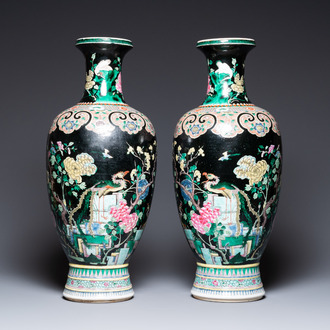 A pair of Chinese famille noire vases, 19th C.