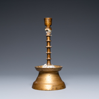 A Flemish or Dutch knotted bronze candlestick, 15th C.