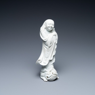 A Chinese Dehua blanc de Chine figure of Liu Hai with the toad, Kangxi