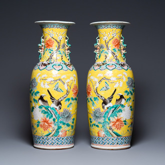 A pair of Chinese yellow-ground famille rose vases, 19th C.