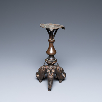 A Chinese bronze candlestick, Ming