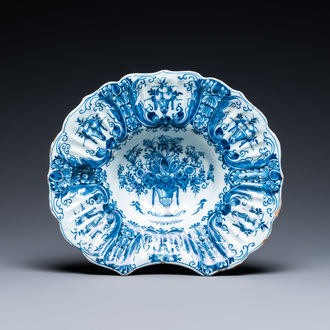 A gadrooned Dutch Delft blue and white shaving bowl, 18th C.