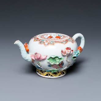 A Chinese famille rose teapot with applied floral design, Yongzheng