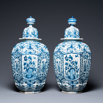 A pair of large ribbed Dutch Delft blue and white covered vases, 1st quarter 18th C.