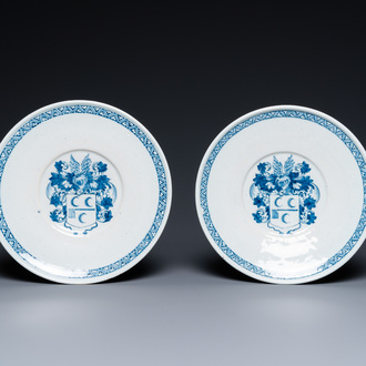 A pair of Dutch Delft blue and white armorial dishes, late 17th C.
