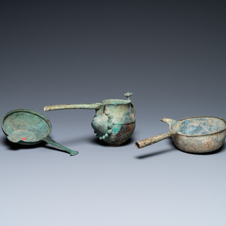 Two Luristan bronze pouring bowls and a spouted vessel, Iran, 1st millenium BC