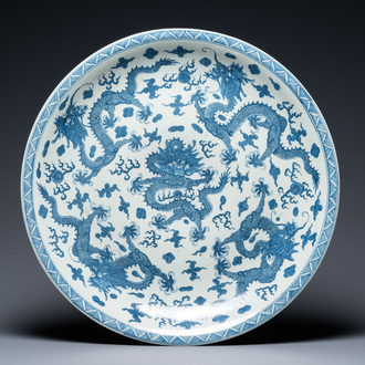A massive Chinese blue and white 'dragon' dish, Kangxi mark, 19th C.