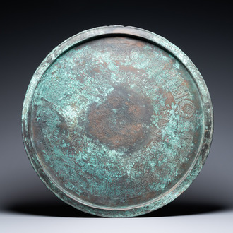 A large Seljuk bronze dish with engraved birds and Kufic inscriptions, Iran, 12/14th C.