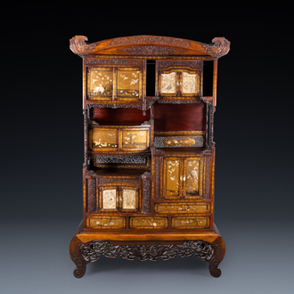 A Japanese 'chigaidansu' gilt-lacquered wood cabinet with finely carved ivory insets, Meiji, 19th C.