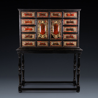 A tortoise veneer, gilt copper, ebony and ebonised wooden mirrored interior cabinet on stand, Antwerp, 17th C.