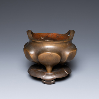 A Chinese bronze censer on lotus stand, Xuande mark, 19th C.