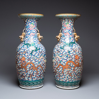 A pair of large Chinese famille rose 'dragon' vases, 19th C.