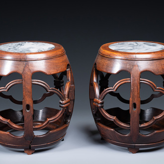 A pair of Chinese reticulated hongmu wooden stands with marble 'dreamstone' plaques, 19th C.