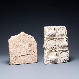 A marble 'horserider' tile fragment and a sandstone fragment with birds and floral vines, Persia, 13th C. and/or later