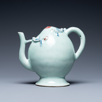 A Chinese relief-decorated peach-shaped 'cadogan' teapot in copper-red and blue on celadon-ground, 19th C.