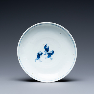 A Chinese blue and white ko-sometsuke plate with three playing boys for the Japanese market, Transitional period
