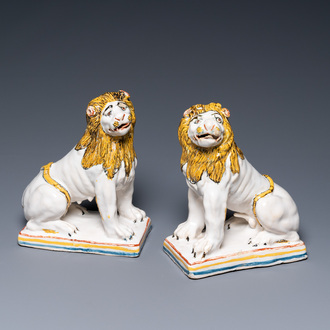 A pair of polychrome French faience lions, Rouen, 1st half 18th C.