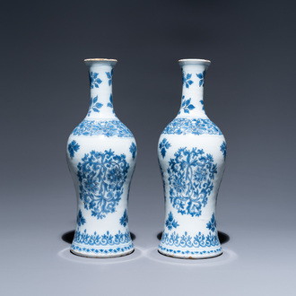 A pair of Dutch Delft blue and white bottle vases with floral design, late 17th C.