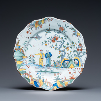 A fine polychrome French faience 'pastoral' dish with lobed border, Rouen, 1st half 18th C.