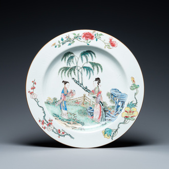 A large Chinese famille rose dish with ladies in a garden, Yongzheng