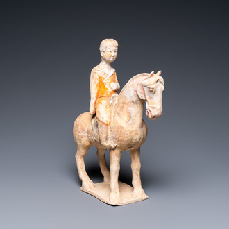 A Chinese painted pottery 'lady on horseback' group, Tang
