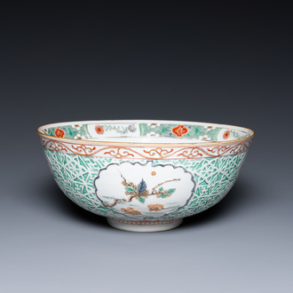 A Chinese famille verte relief-decorated bowl with squirrels and rabbits, Kangxi